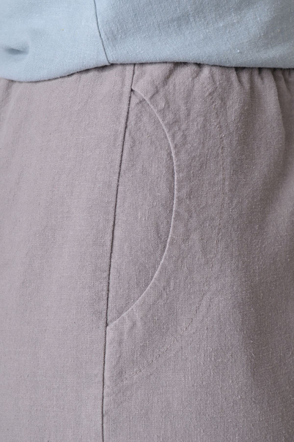 Side seam pockets and a comfy elasticized waist offer stashability and ease.