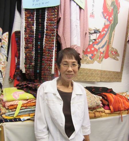 Textile artist selling at Chatuchak Market, Bangkok, Thailand