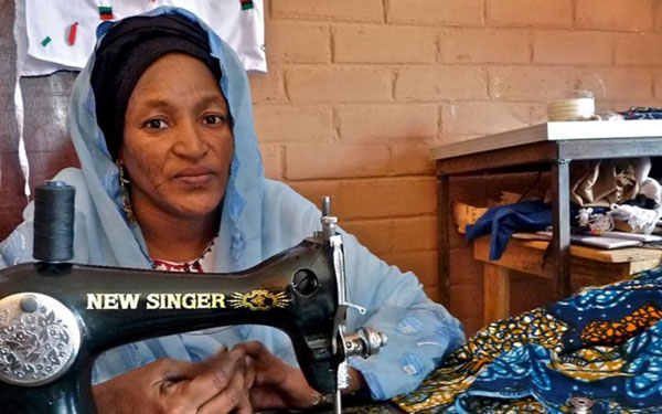 Despite a disability, Hadizatou Ebiliki has risen to the presidency of her seamstress co-op while also learning entrepreneurial skills. (UNDP)