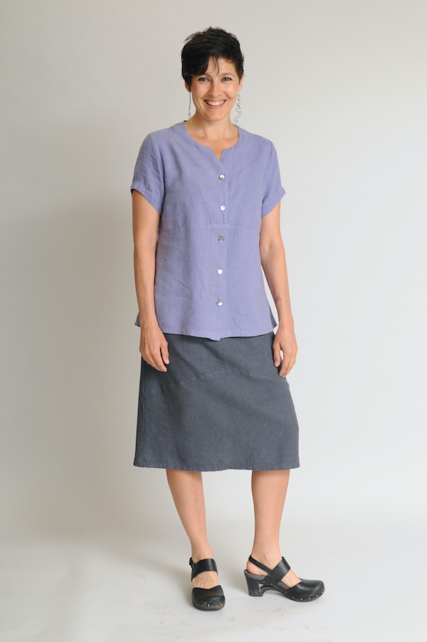 Zoe wears a Spring-friendly Swallowtail Top in Periwinkle over a Curved Skirt in Graphite.
