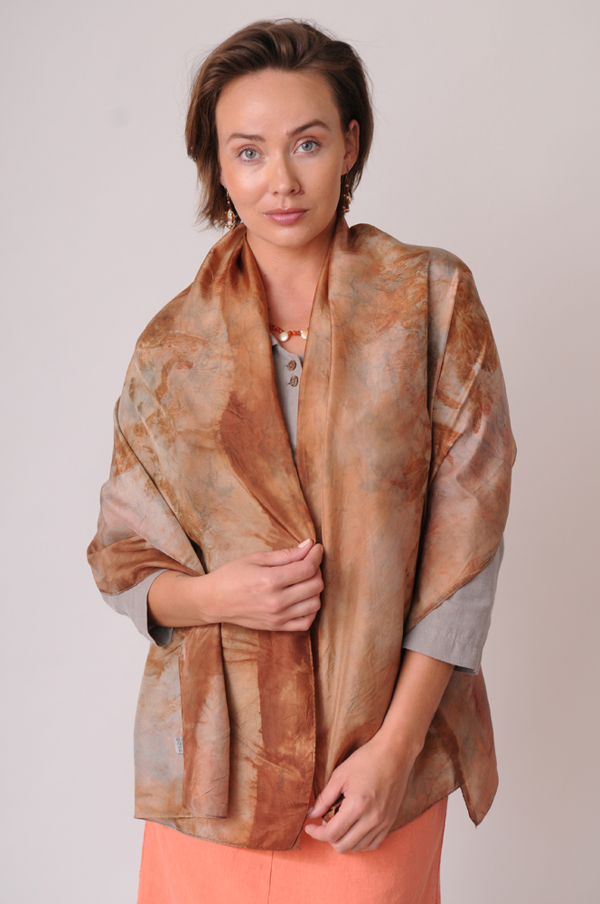 Eucalyptus imparts subtle earth and sky tones, beautifully rendered in this organically dyed silk scarf.