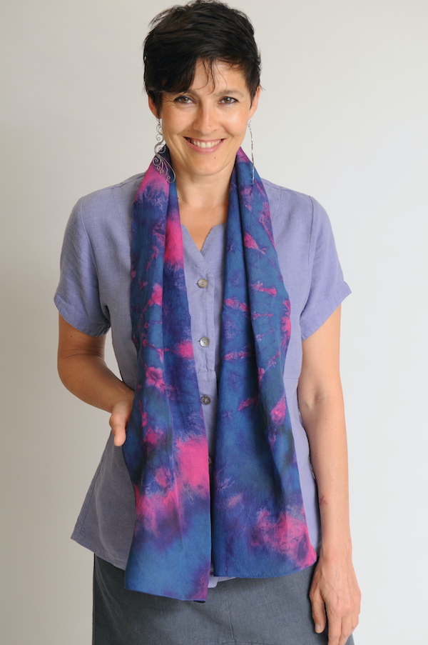 Zoe wears hand-dyed scarf in silk and linen fabric over a Periwinkle Swallowtail Top.
