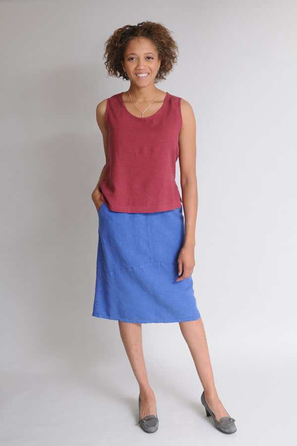 Nikki wears a Tank Top in Garnet over a Curved Skirt in Sapphire.